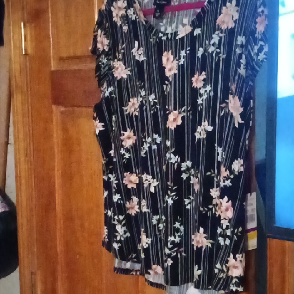 Black flowered short sleeve blouse.